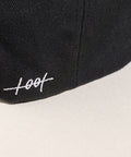 Limited first edition 'A' cap, a classic snapback by Uppr Lowr. The cap features a hand-drawn custom letterform 'A' by Travis Price, exclusive for Uppr Lowr. Crafted from a wool blend, it showcases custom raised embroidery and a deep fit. This collectable cap is a must-have for streetwear enthusiasts.